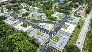 Rarely Available Ground-Floor Condo in Vibrant 55+ Green Dolphin on Tarpon Springs Golf Course in Florida - for sale on GolfHomes.com, golf home, golf lot