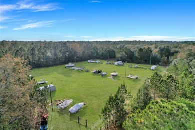 EXPERIENCE THE ULTIMATE LOW COUNTRY LIVING IN A COASTAL FISHING on Sapelo Hammock Golf Club in Georgia - for sale on GolfHomes.com, golf home, golf lot