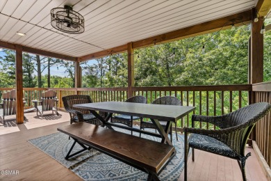 This beautifully designed 3-bedroom, 2.5-bath cabin, featuring a on Bent Creek Golf Course in Tennessee - for sale on GolfHomes.com, golf home, golf lot