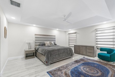 Stunning recently renovated 4 BR home, nestled within the highly on Bear Lakes Country Club in Florida - for sale on GolfHomes.com, golf home, golf lot
