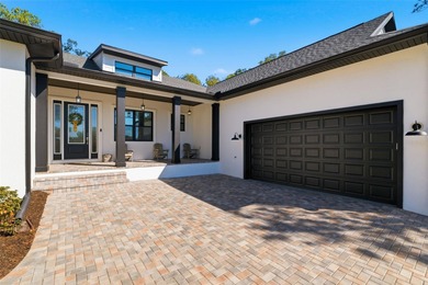 Completed in 2024 and masterfully enhanced with over $50,000 in on Southern Hills Plantation Club in Florida - for sale on GolfHomes.com, golf home, golf lot