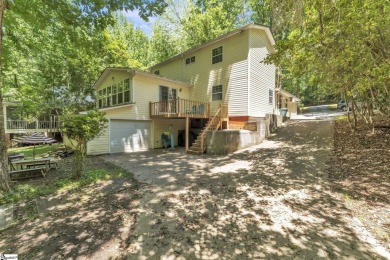 Welcome to 303 Manitowoc Drive, tucked within the highly on The Trail At Chickasaw Pointe in South Carolina - for sale on GolfHomes.com, golf home, golf lot