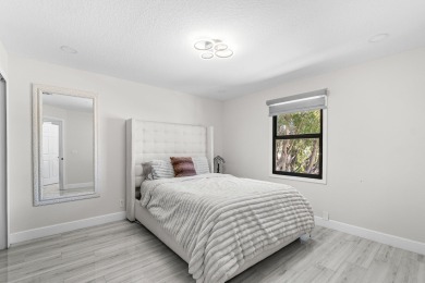 Stunning recently renovated 4 BR home, nestled within the highly on Bear Lakes Country Club in Florida - for sale on GolfHomes.com, golf home, golf lot