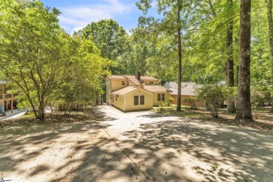 Welcome to 303 Manitowoc Drive, tucked within the highly on The Trail At Chickasaw Pointe in South Carolina - for sale on GolfHomes.com, golf home, golf lot