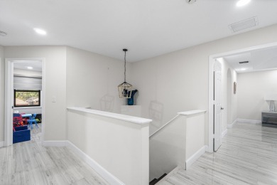 Stunning recently renovated 4 BR home, nestled within the highly on Bear Lakes Country Club in Florida - for sale on GolfHomes.com, golf home, golf lot