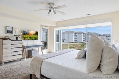 Experience lakefront living at 488 Regatta Bay Circle #2C, where on Seasons Ridge At Four Seasons in Missouri - for sale on GolfHomes.com, golf home, golf lot