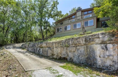 This lake view home on Table Rock Lake is perfect for those who on Holiday Island Executive Golf Course in Arkansas - for sale on GolfHomes.com, golf home, golf lot