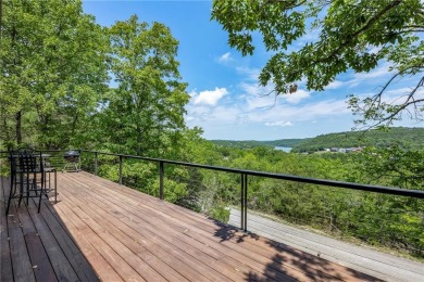 This lake view home on Table Rock Lake is perfect for those who on Holiday Island Executive Golf Course in Arkansas - for sale on GolfHomes.com, golf home, golf lot