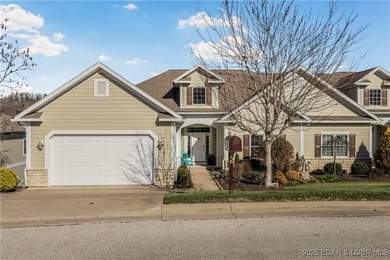 Discover refined lake living at the Villas of Country Club Cove on Seasons Ridge At Four Seasons in Missouri - for sale on GolfHomes.com, golf home, golf lot