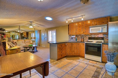 Charming 2-bedroom home featuring a split floor plan and an on The Refuge Golf and Country Club in Arizona - for sale on GolfHomes.com, golf home, golf lot