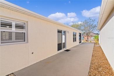 This meticulously maintained 2/2 Block/Stucco WOODLAWN Courtyard on The Links of Spruce Creek in Florida - for sale on GolfHomes.com, golf home, golf lot