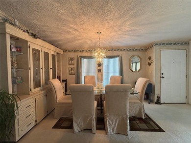 Welcome to Zellwood Station! This 2-bedroom, 2-bath home boasts on Zellwood Station Country Club in Florida - for sale on GolfHomes.com, golf home, golf lot