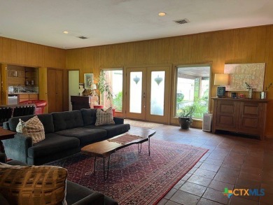 Welcome to your dream home-an exquisite mid-century modern on Victoria Country Club in Texas - for sale on GolfHomes.com, golf home, golf lot