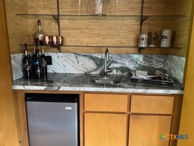 Welcome to your dream home-an exquisite mid-century modern on Victoria Country Club in Texas - for sale on GolfHomes.com, golf home, golf lot