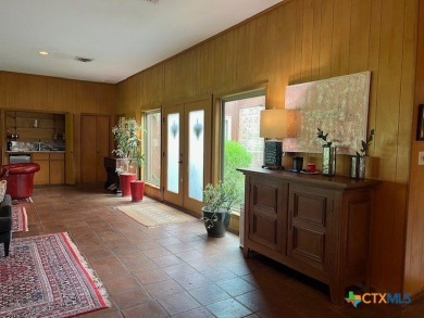 Welcome to your dream home-an exquisite mid-century modern on Victoria Country Club in Texas - for sale on GolfHomes.com, golf home, golf lot
