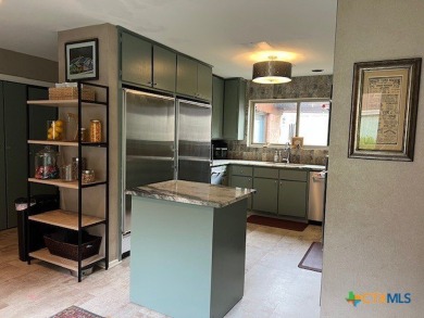 Welcome to your dream home-an exquisite mid-century modern on Victoria Country Club in Texas - for sale on GolfHomes.com, golf home, golf lot