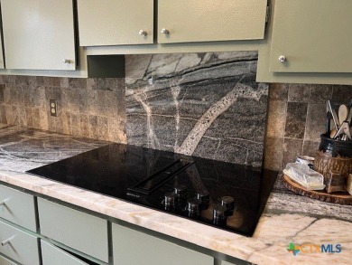 Welcome to your dream home-an exquisite mid-century modern on Victoria Country Club in Texas - for sale on GolfHomes.com, golf home, golf lot
