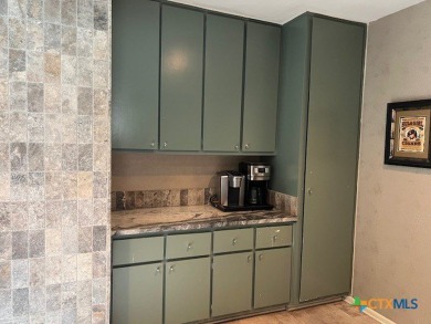 Welcome to your dream home-an exquisite mid-century modern on Victoria Country Club in Texas - for sale on GolfHomes.com, golf home, golf lot