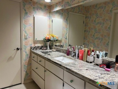 Welcome to your dream home-an exquisite mid-century modern on Victoria Country Club in Texas - for sale on GolfHomes.com, golf home, golf lot