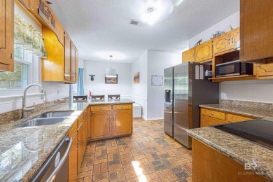 New Orleans-style two-story home located on a quiet street in on Lake Forest Yacht and Country Club in Alabama - for sale on GolfHomes.com, golf home, golf lot
