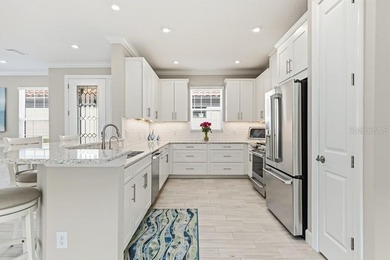 Live the resort lifestyle every day in this beautifully on Esplanade Golf and Country at Lakewood Ranch in Florida - for sale on GolfHomes.com, golf home, golf lot