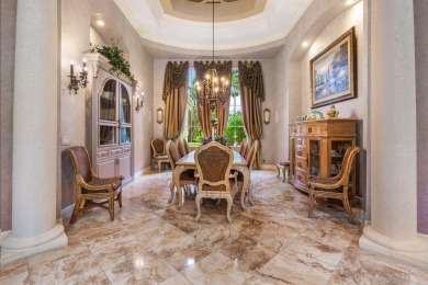 Spectacular estate home in the exclusive enclave of Grand Pointe on BallenIsles Golf and Country Club in Florida - for sale on GolfHomes.com, golf home, golf lot