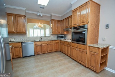 Welcome to this gorgeous brick Traditional with fabulous golf on Braelinn Golf Club in Georgia - for sale on GolfHomes.com, golf home, golf lot