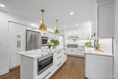 Experience the perfect blend of classic architecture and modern on Lake Barrington Shores Golf Course in Illinois - for sale on GolfHomes.com, golf home, golf lot