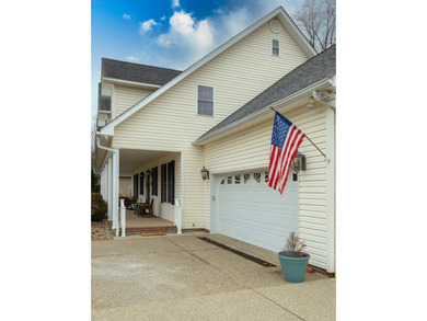 You're invited to experience a home where elegance feels on The Esquire Country Club in West Virginia - for sale on GolfHomes.com, golf home, golf lot