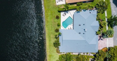 Rarely available contemporary lakefront, one-story home located on Boca West Golf and Country Club in Florida - for sale on GolfHomes.com, golf home, golf lot