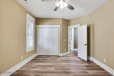 Welcome to this charming home with an inviting, rocking on Cape Fear National At Brunswick Forest in North Carolina - for sale on GolfHomes.com, golf home, golf lot