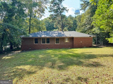 Charming brick home with a brand-new Roof as of August 2025! New on Bowden Golf Course in Georgia - for sale on GolfHomes.com, golf home, golf lot