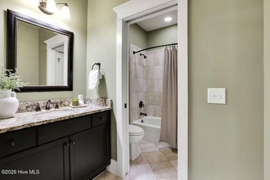 Welcome to this charming home with an inviting, rocking on Cape Fear National At Brunswick Forest in North Carolina - for sale on GolfHomes.com, golf home, golf lot