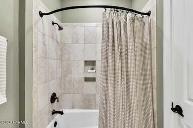 Welcome to this charming home with an inviting, rocking on Cape Fear National At Brunswick Forest in North Carolina - for sale on GolfHomes.com, golf home, golf lot