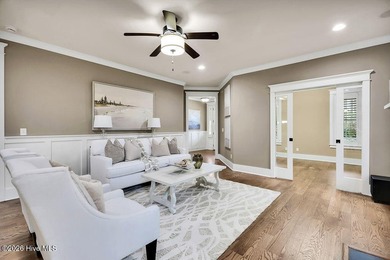 Welcome to this charming home with an inviting, rocking on Cape Fear National At Brunswick Forest in North Carolina - for sale on GolfHomes.com, golf home, golf lot