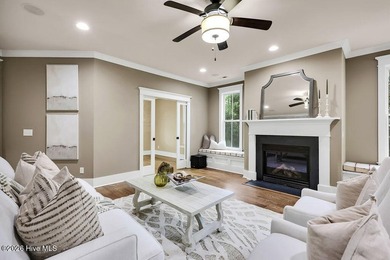 Welcome to this charming home with an inviting, rocking on Cape Fear National At Brunswick Forest in North Carolina - for sale on GolfHomes.com, golf home, golf lot