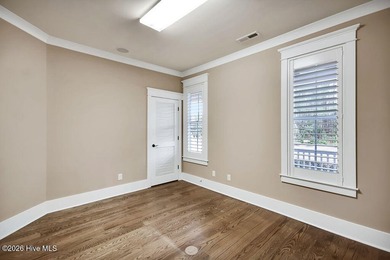 Welcome to this charming home with an inviting, rocking on Cape Fear National At Brunswick Forest in North Carolina - for sale on GolfHomes.com, golf home, golf lot