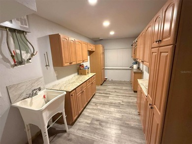 Short Sale. This LARGE 4/2/2 pool home sits on a peaceful on Port Charlotte Golf Club in Florida - for sale on GolfHomes.com, golf home, golf lot