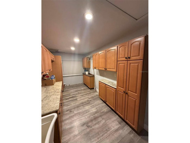 Short Sale. This LARGE 4/2/2 pool home sits on a peaceful on Port Charlotte Golf Club in Florida - for sale on GolfHomes.com, golf home, golf lot