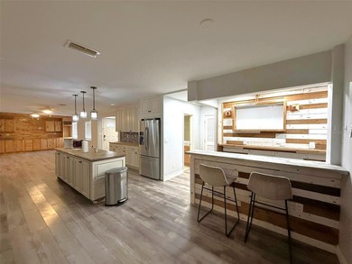 Short Sale. This LARGE 4/2/2 pool home sits on a peaceful on Port Charlotte Golf Club in Florida - for sale on GolfHomes.com, golf home, golf lot