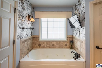 Welcome to your serene sanctuary in East Side Huntington on Hulman Links Golf Course in Indiana - for sale on GolfHomes.com, golf home, golf lot