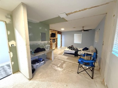 Short Sale. This LARGE 4/2/2 pool home sits on a peaceful on Port Charlotte Golf Club in Florida - for sale on GolfHomes.com, golf home, golf lot