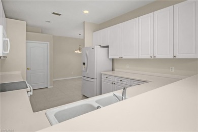 Welcome home to this spaciously designed end unit Villa flooded on Arrowhead Golf Club At Heritage Greens in Florida - for sale on GolfHomes.com, golf home, golf lot