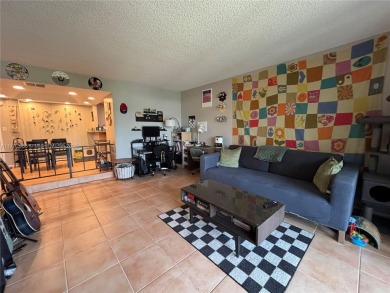 UPDATED 3rd Floor 1 bedroom/1.5 bath condo in International on Inverrary Country Club in Florida - for sale on GolfHomes.com, golf home, golf lot