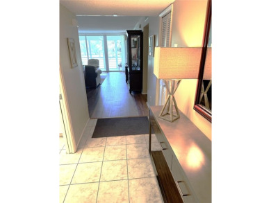 Beautifully updated 2BR/2BA condo in lush Palm Aire with on Palm-Aire Country Club and Resort - The Oaks in Florida - for sale on GolfHomes.com, golf home, golf lot
