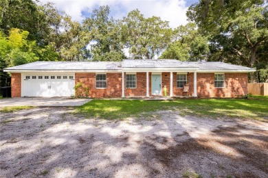 Welcome, golf enthusiasts! Step into this charming four-bedroom on Chiefland Golf and Country Club in Florida - for sale on GolfHomes.com, golf home, golf lot