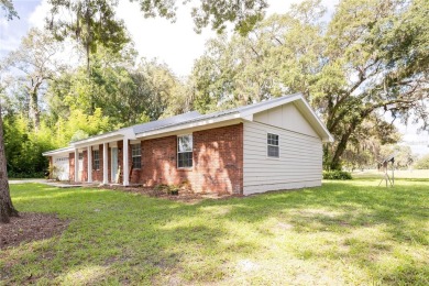 Welcome, golf enthusiasts! Step into this charming four-bedroom on Chiefland Golf and Country Club in Florida - for sale on GolfHomes.com, golf home, golf lot