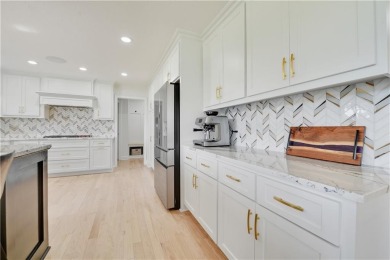 EXPERIENCE RESORT-STYLE LIVING IN THIS FULLY REMODELED 1.5 STORY on Leawood South Country Club in Kansas - for sale on GolfHomes.com, golf home, golf lot