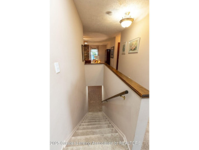 Haslett: Rare offering for this Immaculate 1,700+- sq. ft on Meridian Sun Golf Club in Michigan - for sale on GolfHomes.com, golf home, golf lot