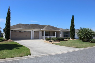 Inviting Sand Dollar model in The Villages' Sanibel neighborhood on Volusia Executive Golf Course  in Florida - for sale on GolfHomes.com, golf home, golf lot